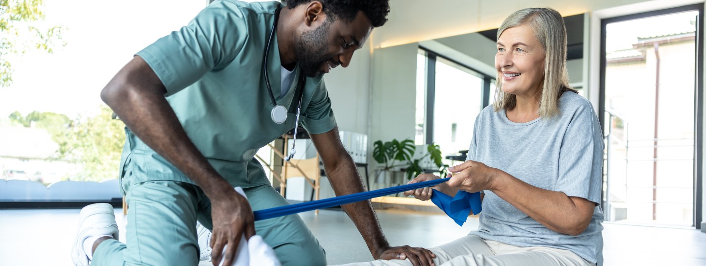 Woman receives physical therapy to her leg