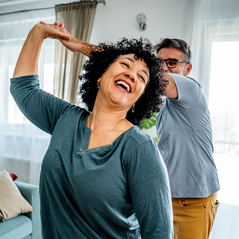 mature couple dancing happily