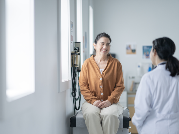 mature woman talks to her physician