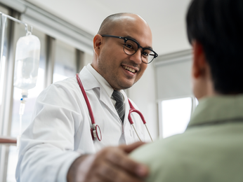 A doctor in discussion with a patient.