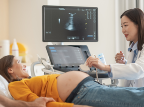 Pregnant mother receiving ultrasound