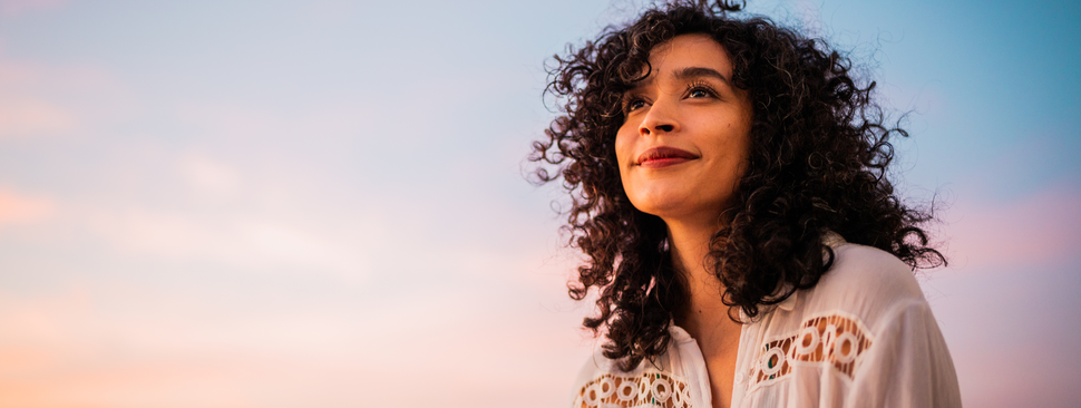 Young woman looking at view contemplating outdoors