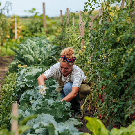 Young adult woman working in a garden