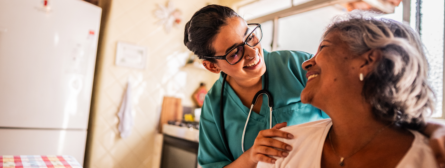 Senior Mexican woman receives home visit from nurse