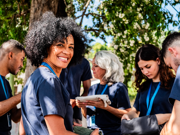 Volunteer at event looks back and smiles