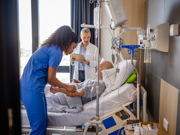 Nurse assisting a patient in the hospital