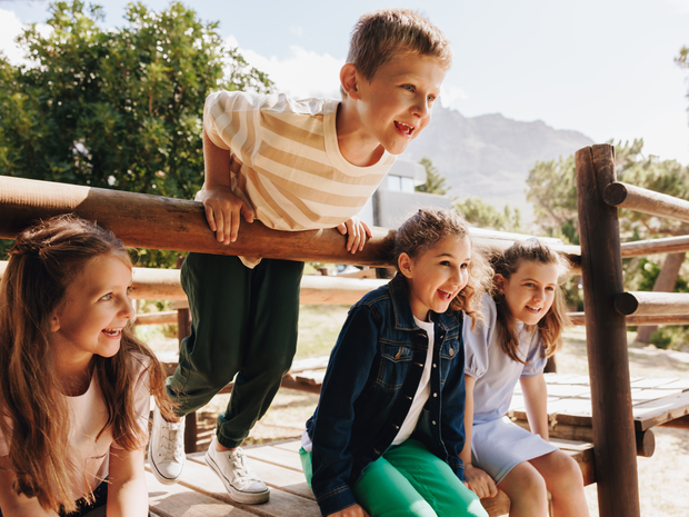 Group of happy children playing outdoors in a nature setting