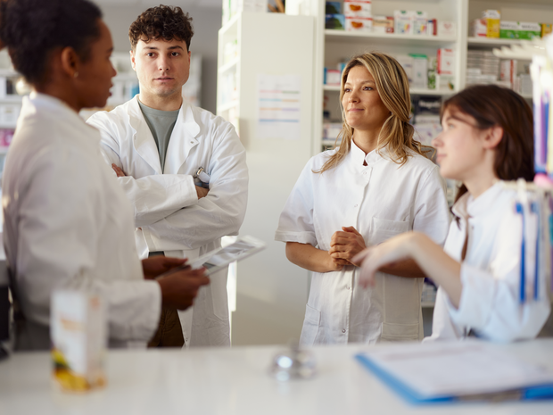 Pharmacists speaking in a group.