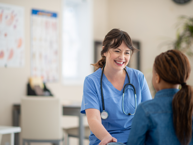 Female provider smiles.