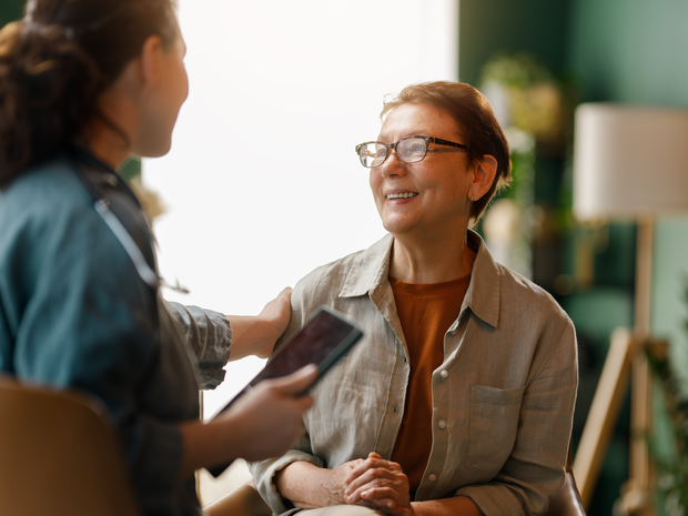 A woman talks with her doctor.