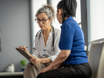 Provider speaks with physical therapist.
