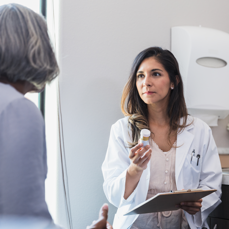 Pharmacist discussing a prescription with patient