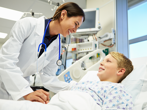 Boy talking to doctor in the hospital