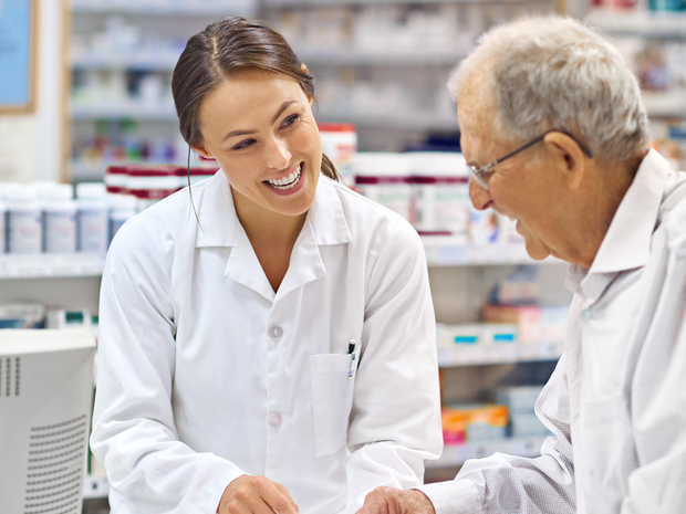 Pharmacist helps a patient