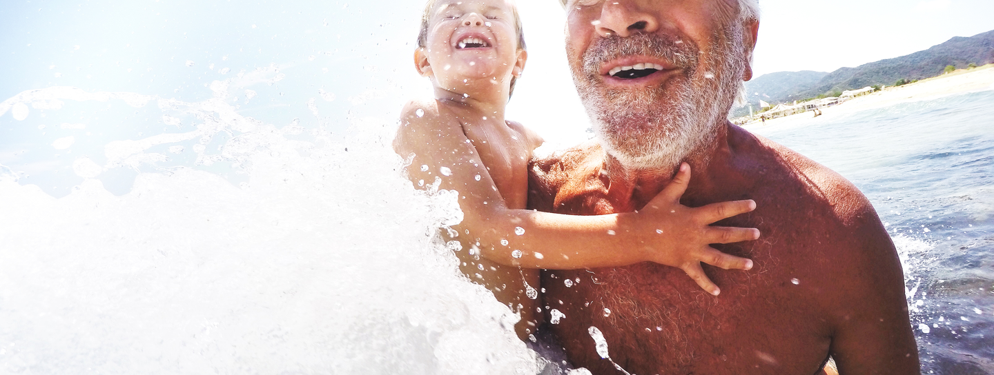 A man holds his grandchild 
