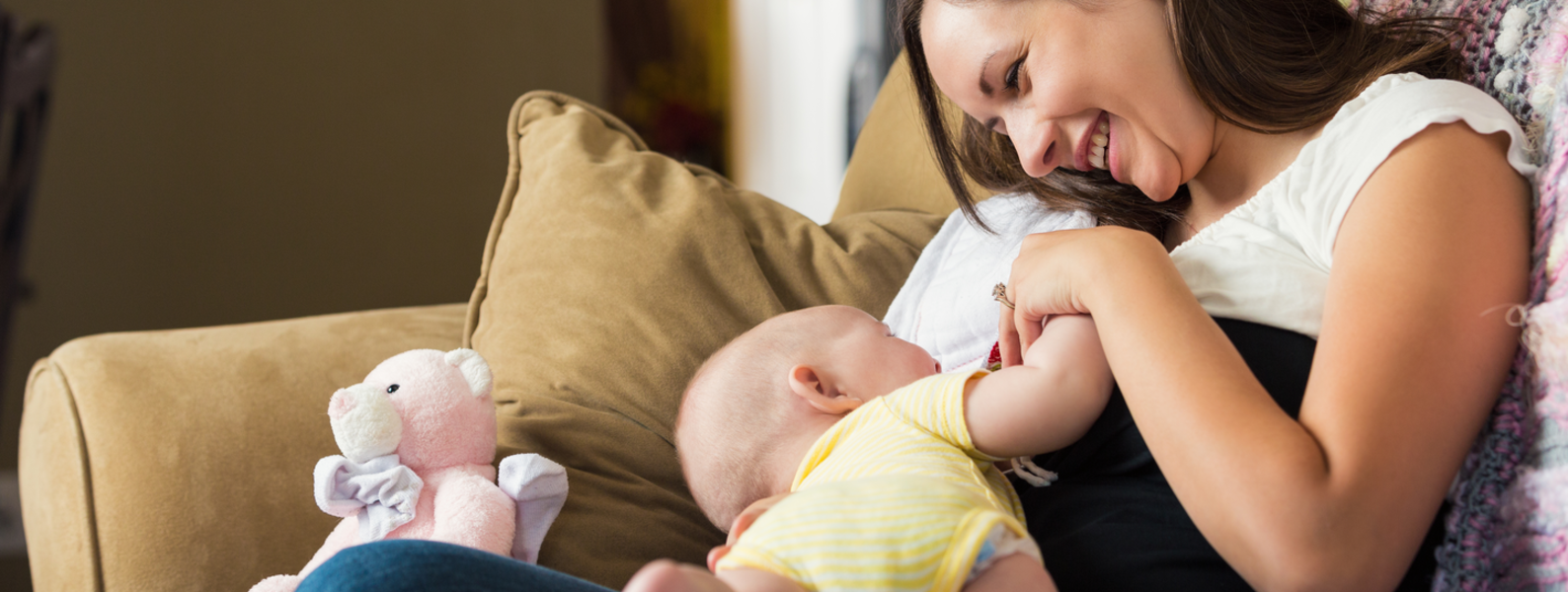 A baby feeding with mother.