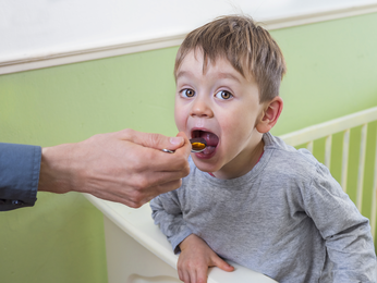 Child being fed lunch.