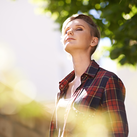 Young lady standing in her garden