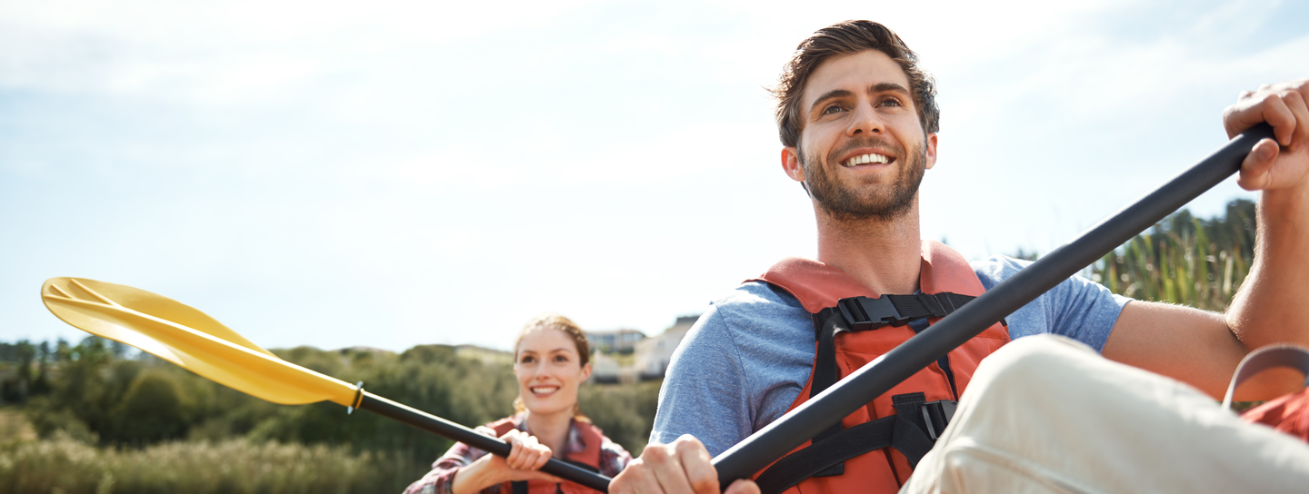 Couple rowing a boat