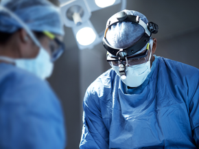 Surgeons performing a surgical procedure