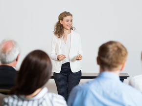 Woman presenting at a conference