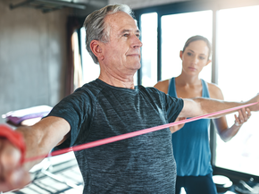 Man working out with a trainer