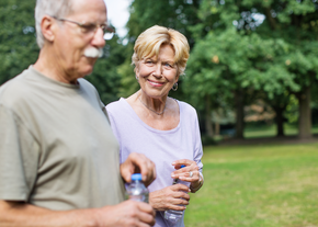 A man and woman walk outdoors