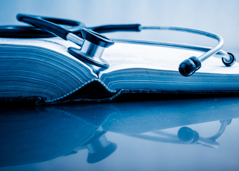 Stethoscope on book.