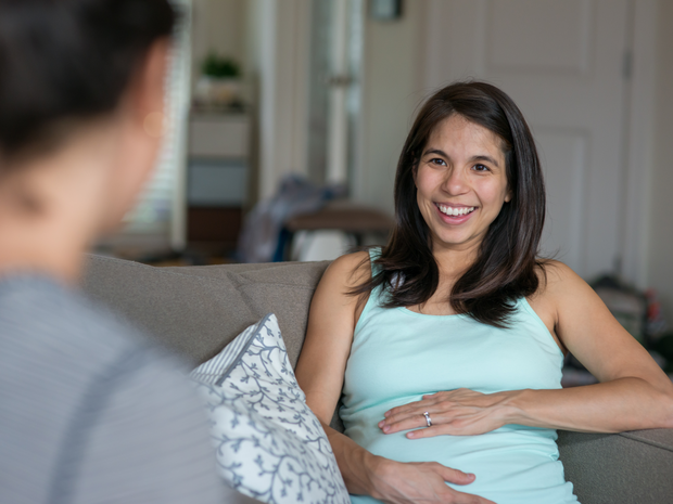 Mother meeting with midwife at home
