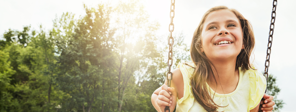 Preteen girl on a swing