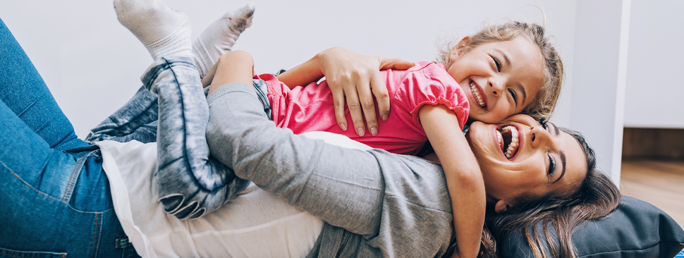 Mom and daughter laughing