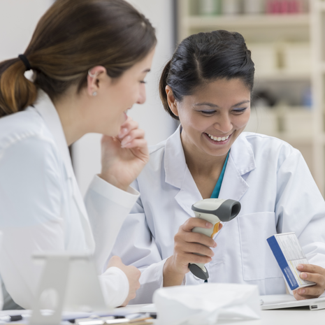 Pharmacist using a tablet to manage prescriptions