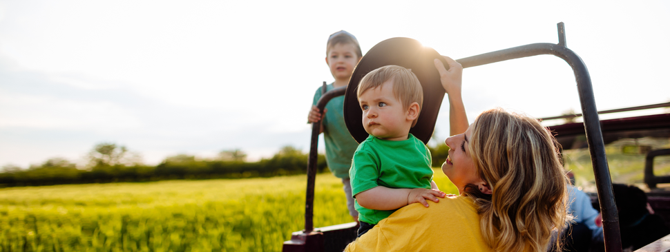 In a pick-up truck at family farm