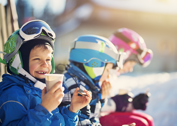 children sitting drinking water.