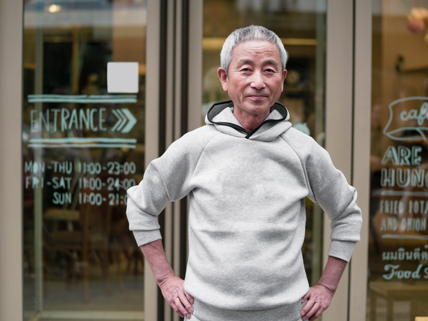 Man standing with hands on his waist.