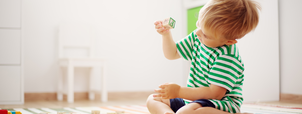 Young boy playing with blocks