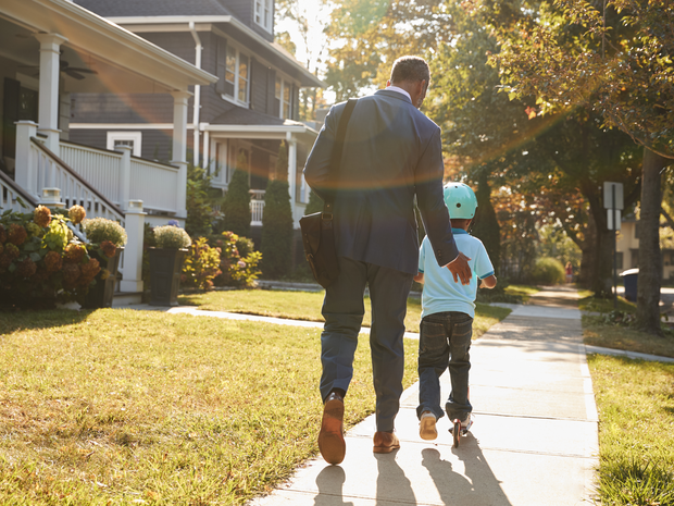 Father walking son to school