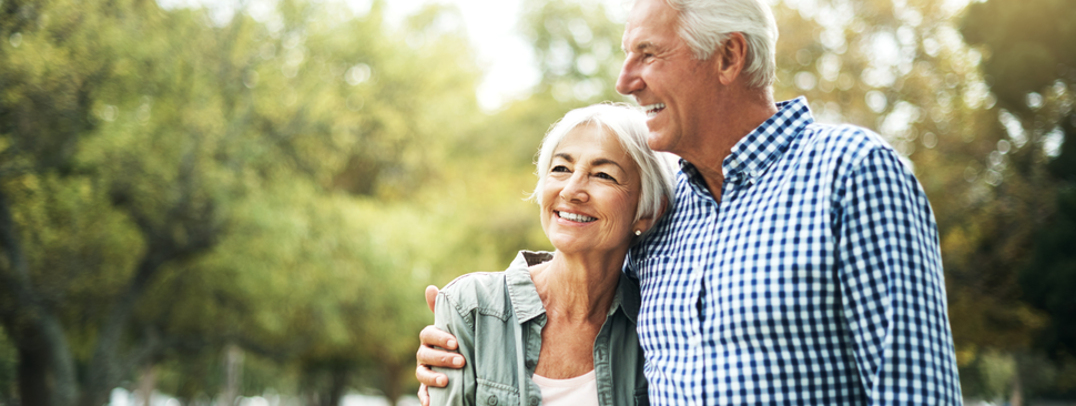 Older couple walking outside