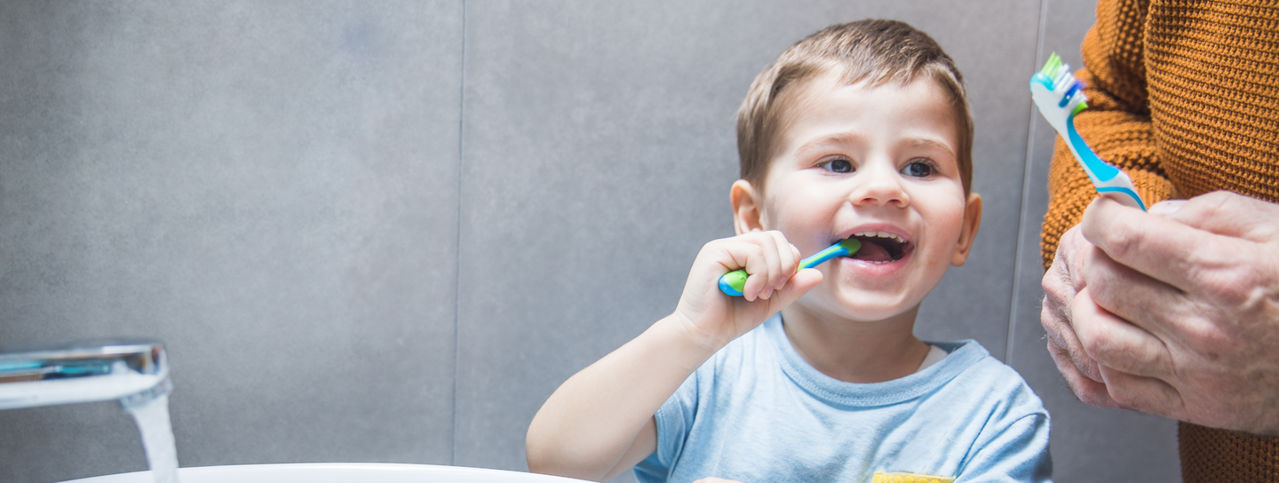 Young boy brushing his teeth