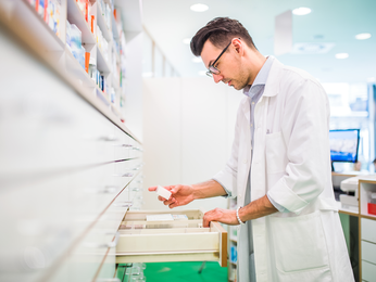 Pharmacist fills a prescription