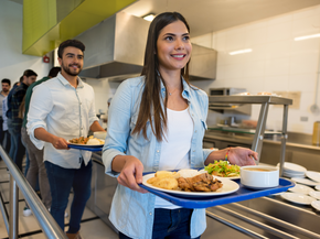 two young people in a cafeteria