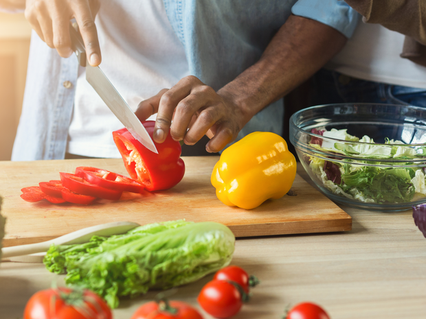 man chopping vegetables
