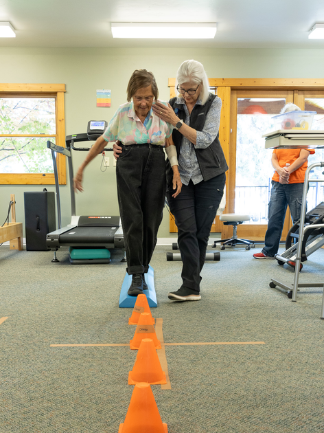Older patient working with physical therapist. 