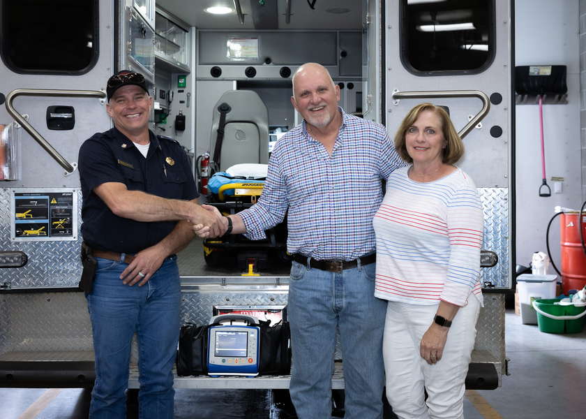 Fire and EMS chief shaking hands with donor.