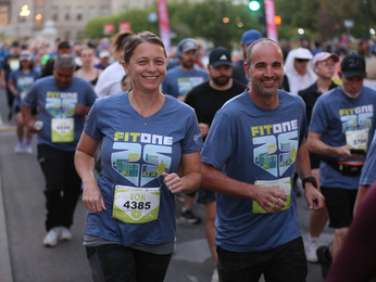 man and woman running the FitOne 10K