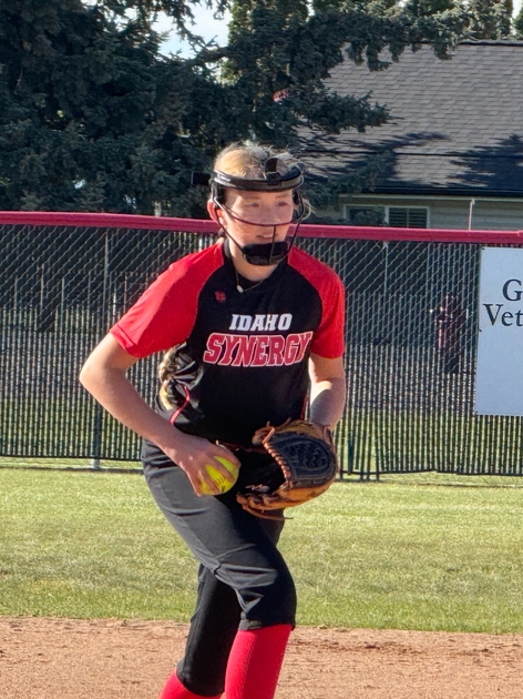 Stewart preparing to pitch a softball during a game.