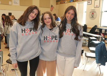 Three high school students wearing Hope Squad Sweatshirts