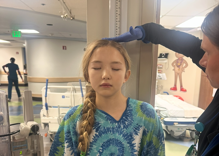 Charlee having height measured.