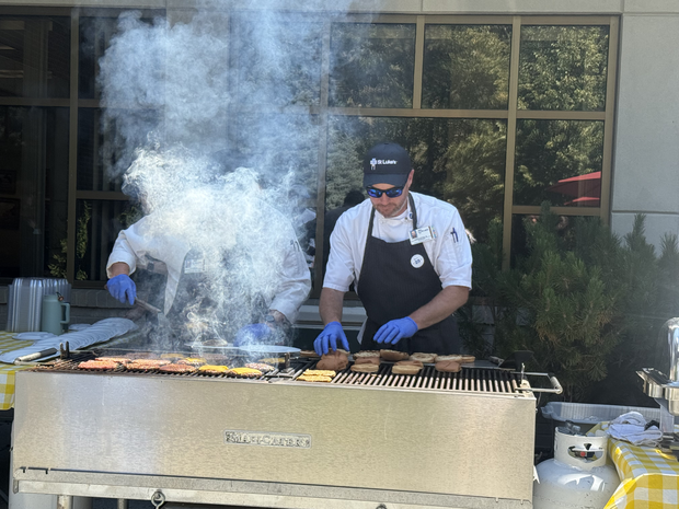St. Luke's employee running grill