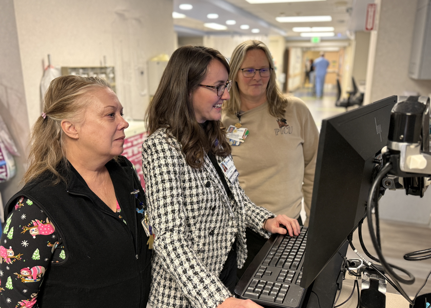 Dr. Garner and team reviewing patient charts. 